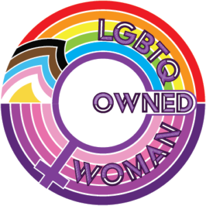 Circular badge with a rainbow and transgender pride pattern, featuring the words LGBTQ and WOMAN OWNED inside a female gender symbol.